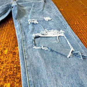 Distress light blue jeans